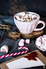 Good New Year spirit. Coffee with marshmallows and cinnamon. Pink mug. Cooking yourself.Home comfort. New Year. Christmas time. Winter mood.Letter to Santa Claus. To Do list.New Year resolution