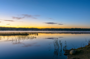 Fototapeta na wymiar Early morning on the lake in the Leningrad region.