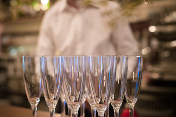 Cocktail party with empty champagne flute glasses at the bar
