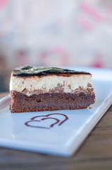 Brownie chocolate cake decorated with chocolate sauce