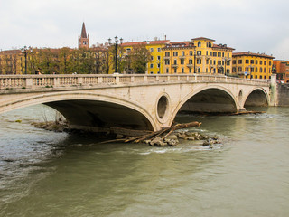 Old historical bridge Ponte della Vittoria across the Adige River in the center of Verona.