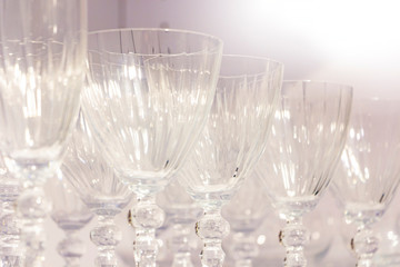 rows of glass wine glasses for drinks.