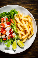 Fried cod and vegetables with french fries