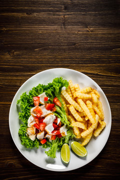 Fried cod and vegetables with french fries