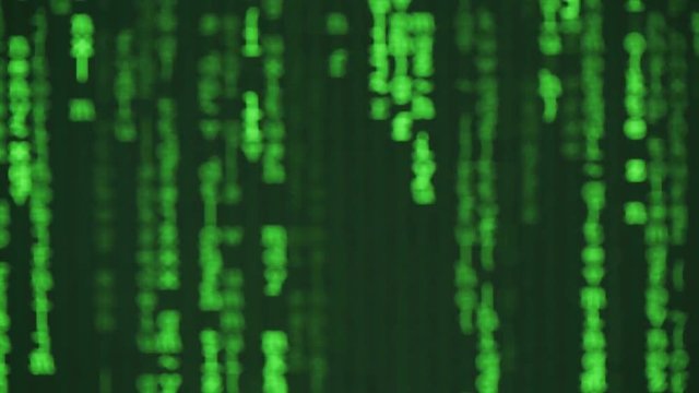 Out of focus computer code in green color on a digital screen.