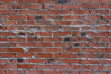 Brick wall of red color. Brickwork. Solution. The work of the Mason.