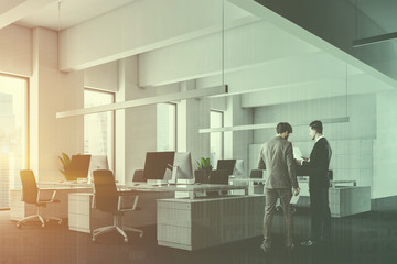 Fototapeta premium White office with lockers, side view, men