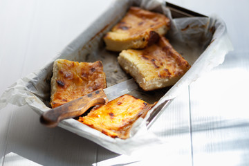 A piece of cottage cheese casserole with sour cream