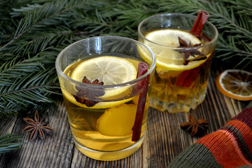Ginger tea with lemon and spices in a glass Hot winter or autumn drink Concept of winter holidays and Christmas