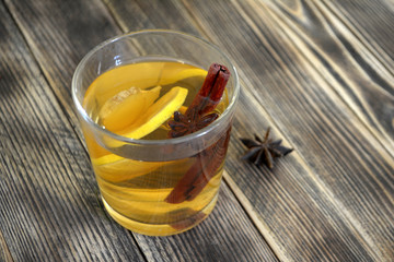 Ginger drink with lemon and spices Ginger tea on wooden table Copy space