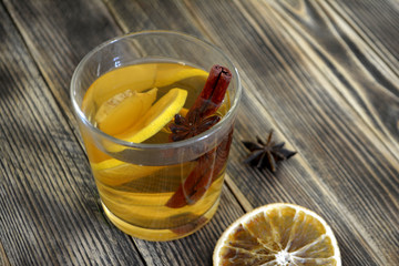 Ginger drink with lemon and spices Ginger tea on wooden table Copy space