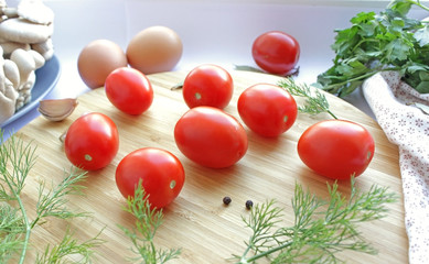 cherry tomatoes on a wooden kitchen board