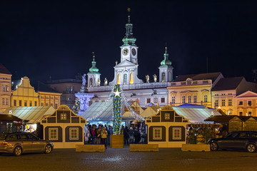 Ceske Budejovice, Czech Republic. The city's main Christmas market at the Premysl Otakar II Square on the background of the old Town Hall in night.