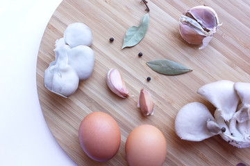 kitchen board with eggs and mushrooms