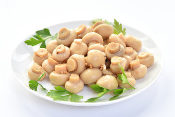 Salted mushrooms on a plate. Restaurant dish.