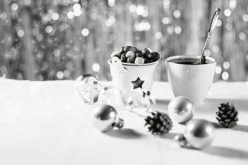 Obraz na płótnie Canvas A cup of cocoa with marshmallows and corn balls in the New Year