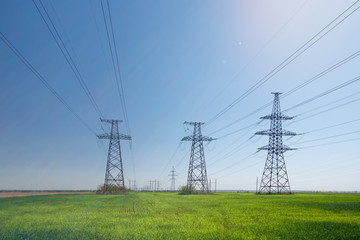 power line summer landscape / passing overhead electricity wire of the support carrying the light and the heat in the house