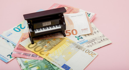 piano on euro and notes background with copy