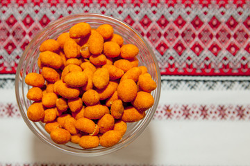 orange peanuts on a red cloth
