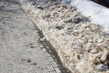 Snow covered pavement background in winter time