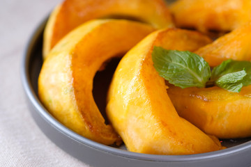 pumpkin slices with honey. Pumpkin on a plate, top view