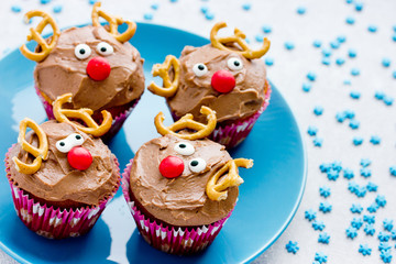 Funny christmas reindeer cupcakes delicious gift for kids for xmas new year holidays © san_ta