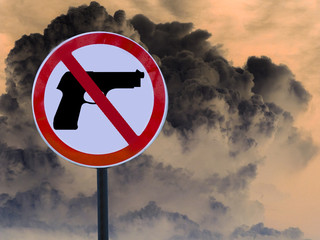 Road sign no gun on the cloud from the explosion.