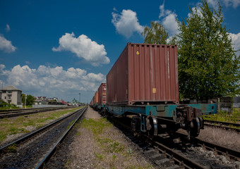 Fototapeta premium Container loaded on train wagons on a railway