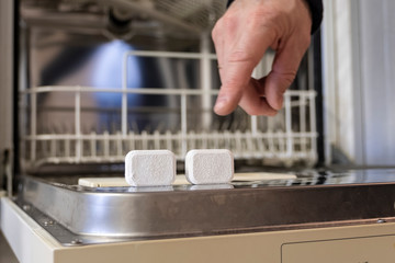  Detergents, tablets on dishwasher background,