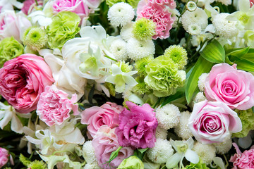 Beautiful flowers background for wedding scene. beautiful bouquet of mixed flowers in a vase on wooden table. the work of the florist at a flower shop. a bright mix of sunflowers.
