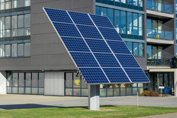 solar panels in front of a building