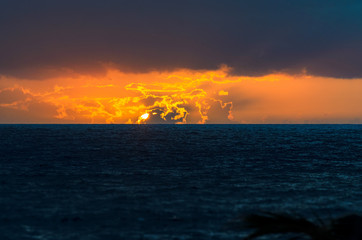 Sunset on the Atlantic Ocean - 2 the sun is dipping into the ocean.