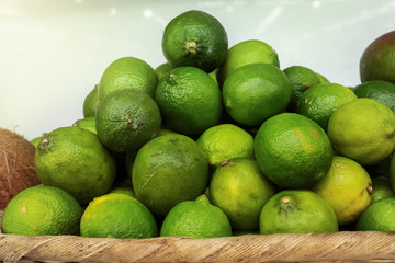 Fresh lime on the shelf in supermarket. A citrus in the fruit market