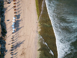 Indonesia, Bali, Aerial view of Balangan beach, sunloungers and beach umbrellas