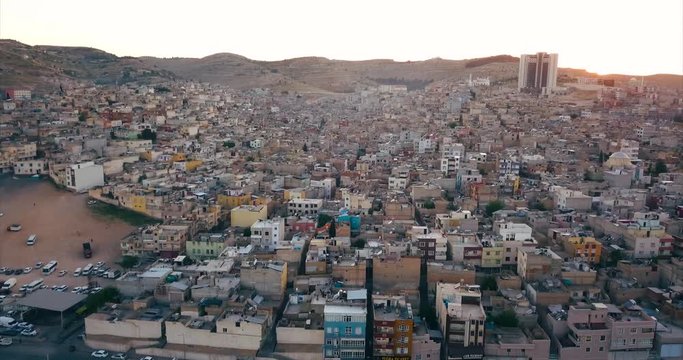 Aerial view of slum buildings in city with sunset time