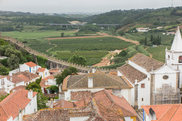 Obraz premium Village, medieval town, Obidos in Portugal. View of white houses, red tiles
