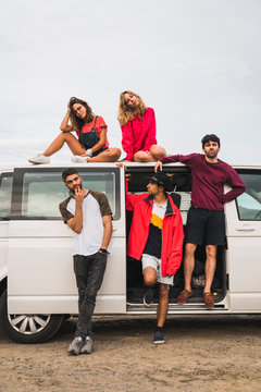 Friends traveling through Norwegian Lapland with a camping van