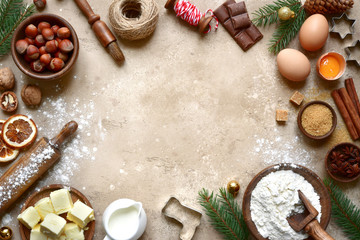 Fototapeta na wymiar Rustic christmas baking background with ingredients for making cookies or cake.Top view with space for text.