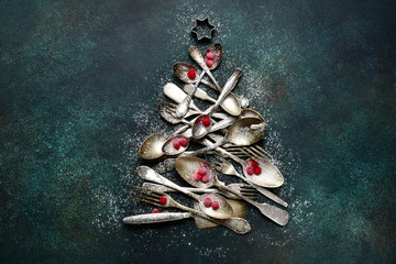 Abstract christmas tree made from vintage cutlery.Top view with copy space.