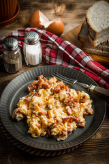 Scrambled eggs with sausage.