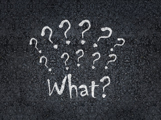Fototapeta premium what with question marks painted on asphalt