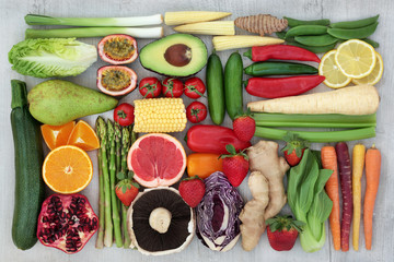 Health food concept for fitness with fresh vegetables, fruit, herbs, spices  Super foods high in antioxidants, anthocyanins, vitamins and dietary fibre. Flat lay.