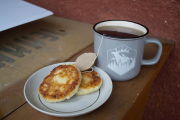 cup of tea with cheese pancakes