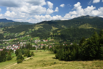 Fototapeta na wymiar Rural village in the valley at the Rodna Nationa Park, Romania.