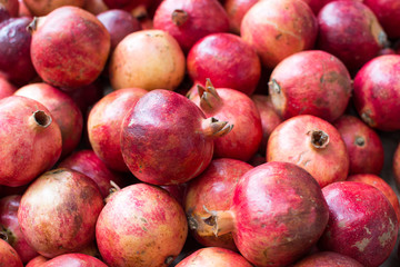 Bunch of red pomegranates at the market