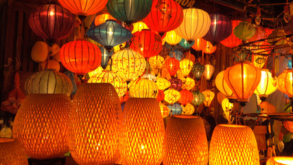 CLOSE UP: Colorful handmade paper lanterns glowing brightly on a festive night.