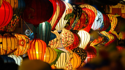 CLOSE UP, DOF: Beautiful shot of traditional lamps lit up on a festive night.