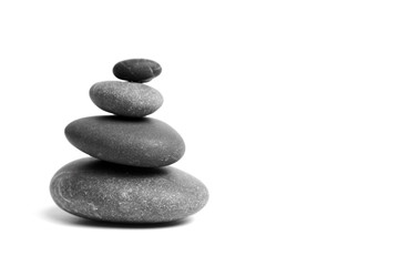 Fototapeta na wymiar Stacked smooth grey stones. Sea pebble. Balancing pebbles isolated on white background