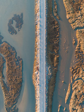 Aerial view on a coastal road at sunset