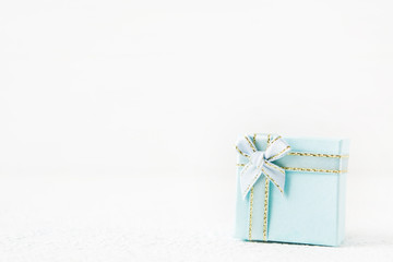Blue gift box for holiday on light background